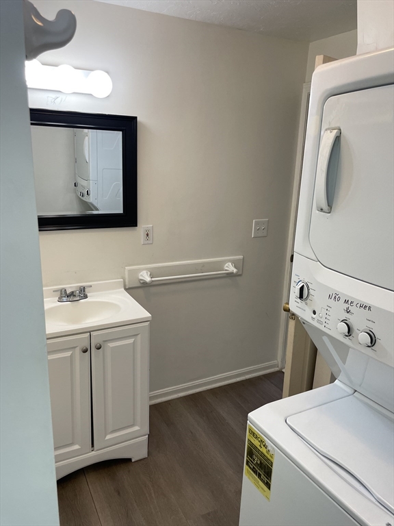 71 Main Street, Unit 2 Blackstone, MA 01504 - Photo 5 of 7 a bathroom with a sink a toilet and mirror