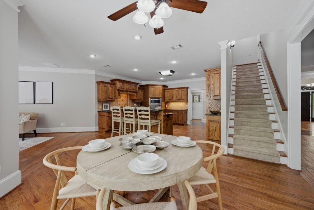 582 Knox Chapel Road Social Circle, GA 30025 - Photo 13 of 49 a kitchen with stainless steel appliances kitchen island granite countertop a table chairs and a refrigerator