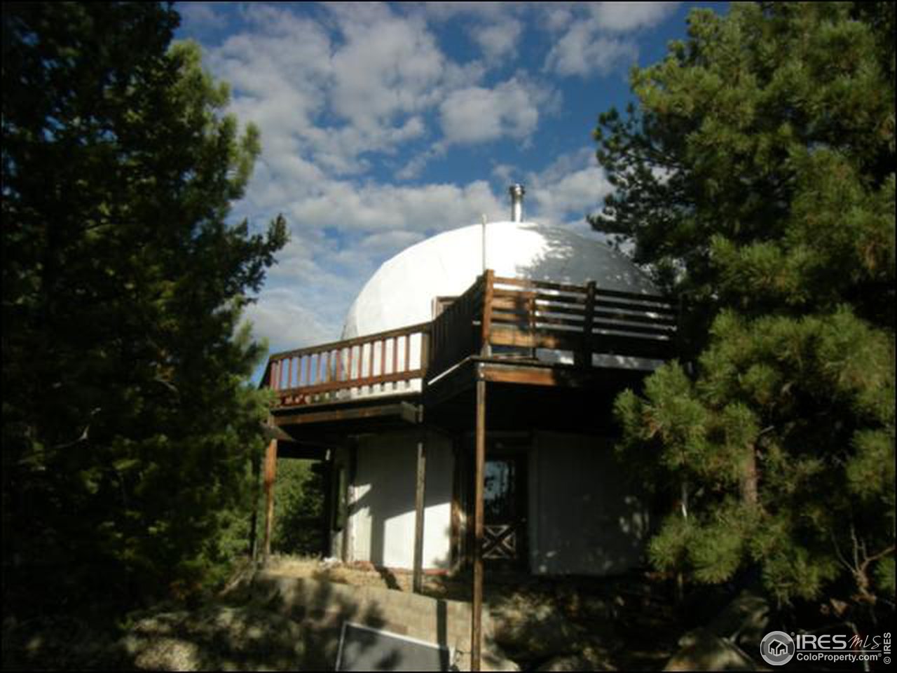 1488 Gold Run Road Boulder, CO 80302 - Photo 7 of 17 a view of a house with a small yard and plants
