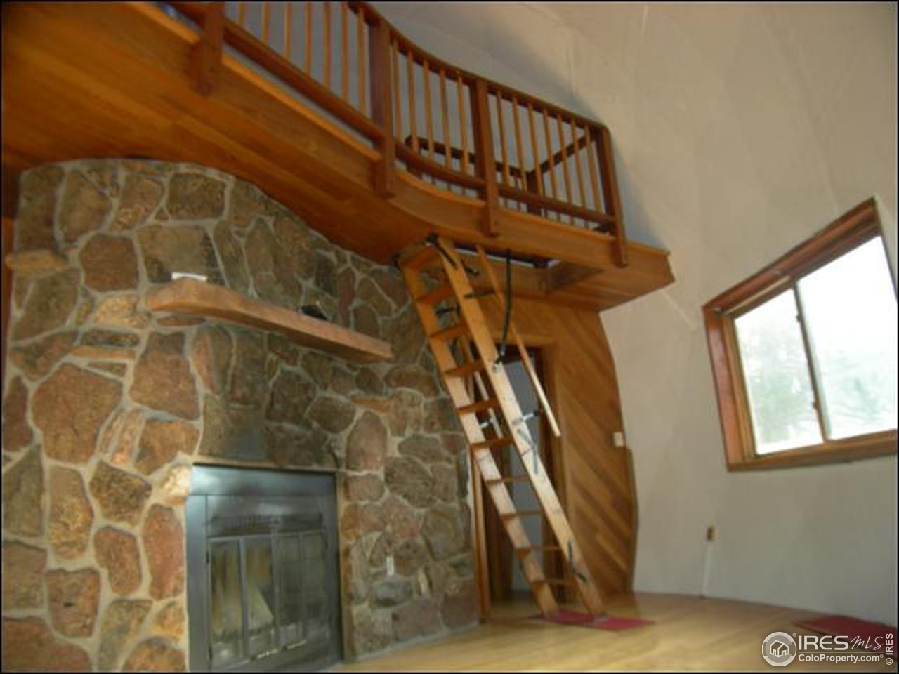 1488 Gold Run Road Boulder, CO 80302 - Photo 9 of 17 a view of staircase with wooden floor and a potted plant