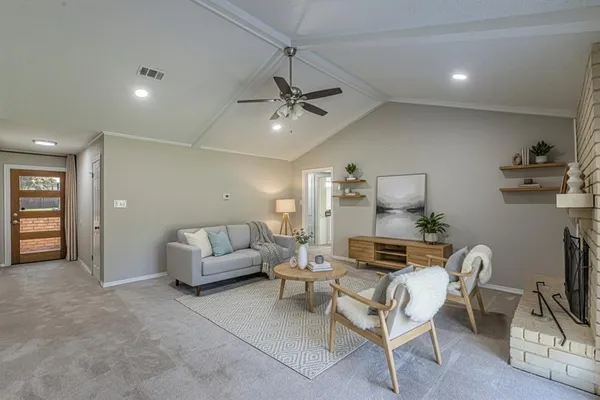a kitchen with granite countertop a refrigerator and a sink