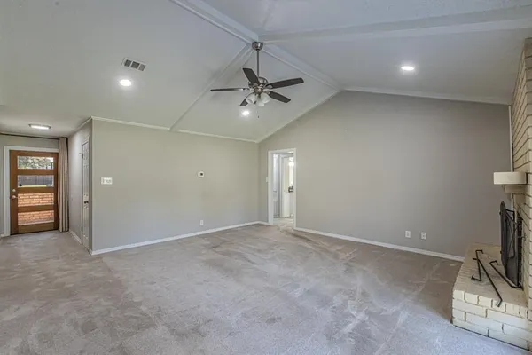 a view of an empty room with a window