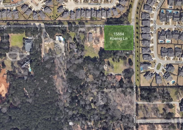 a street sign on a wall next to a building