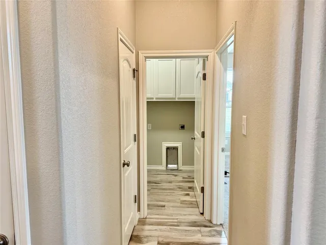 a view of gallery with wooden floor