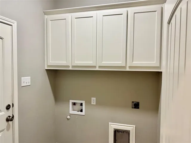 a bathroom with a sink and cabinets