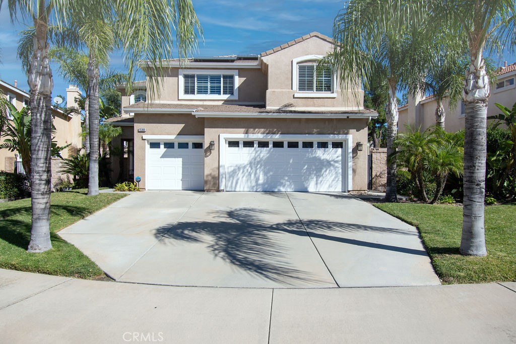15360 Rochelle Street Fontana, CA 92336 - Photo 1 of 1 a front view of a house with a yard