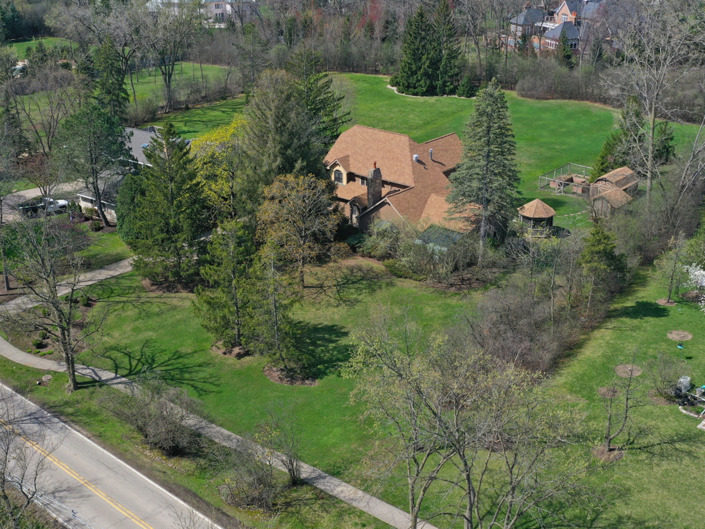 an aerial view of a house with outdoor space and street view