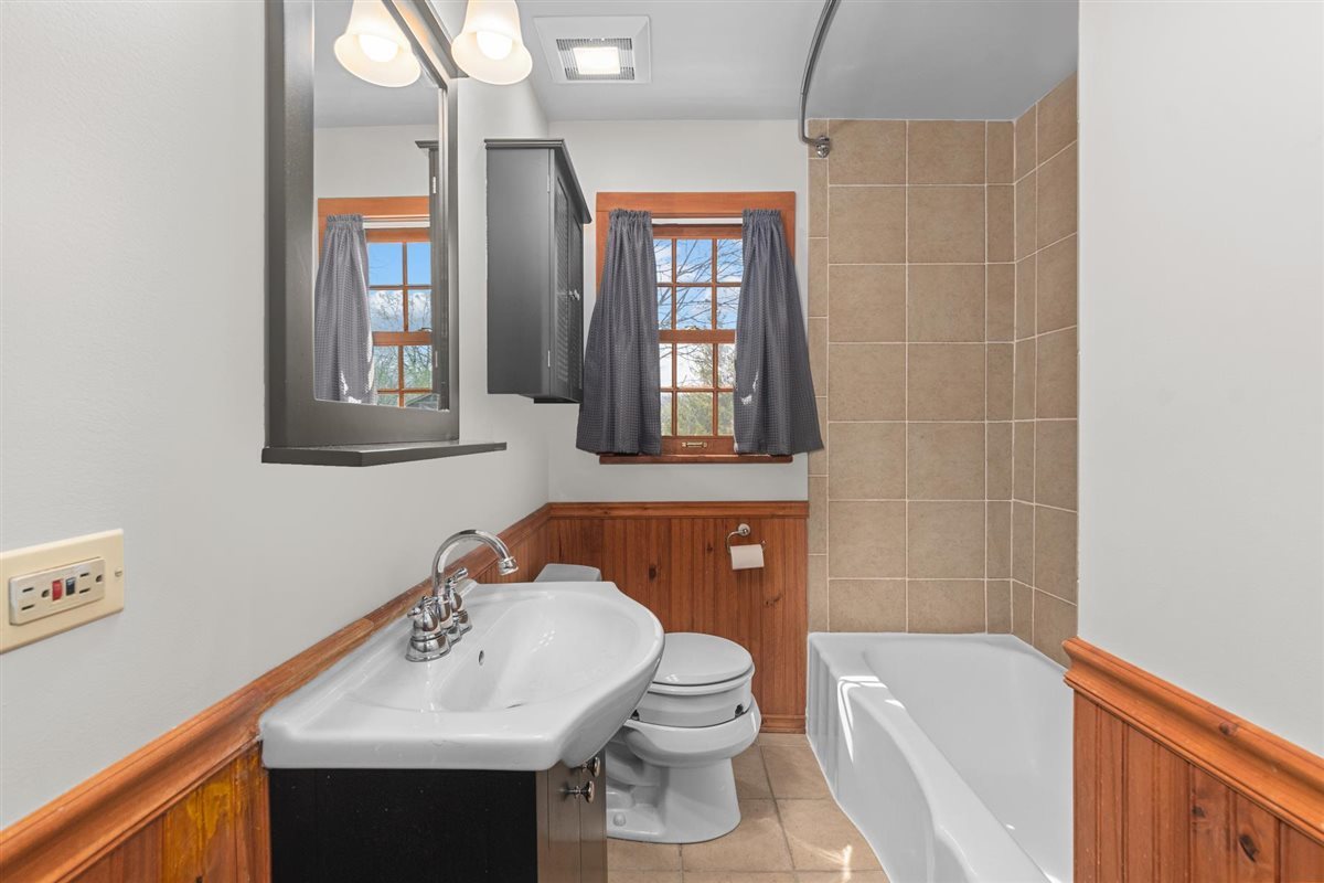 1760 Telegraph Road Lake Forest, IL 60045 - Photo 19 of 50 a bathroom with a sink toilet and shower