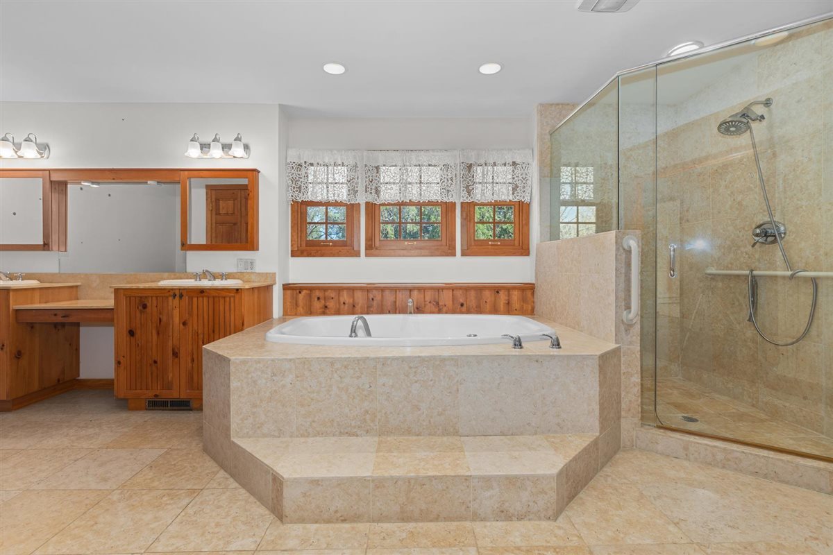 1760 Telegraph Road Lake Forest, IL 60045 - Photo 25 of 50 a bathroom with a tub a sink and a shower