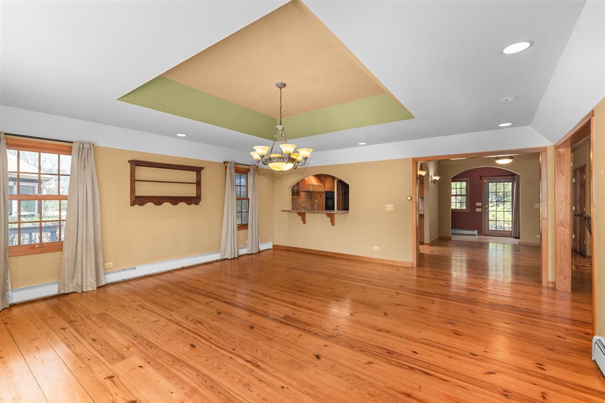 1760 Telegraph Road Lake Forest, IL 60045 - Photo 9 of 50 an empty room with wooden floor chandelier and windows