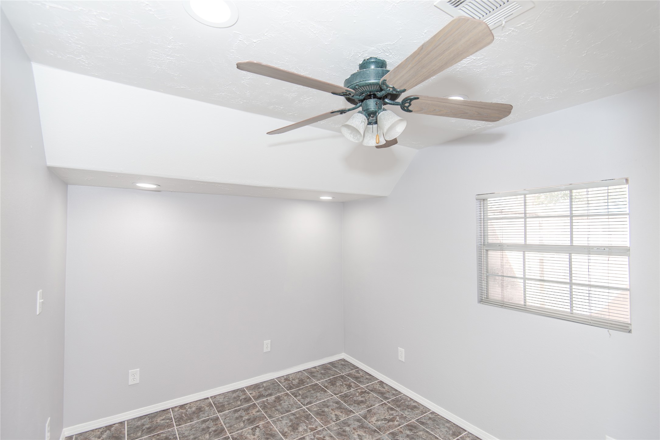 21734 Nickerton Lane Spring, TX 77388 - Photo 28 of 31 an empty room with a window and a fan