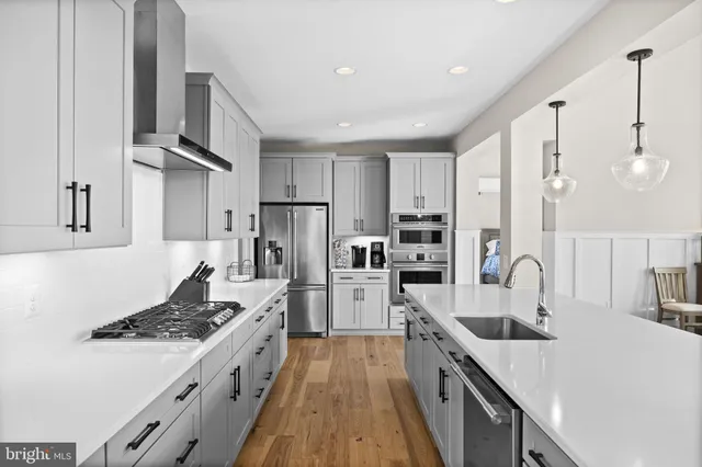a kitchen with a table chairs and a window