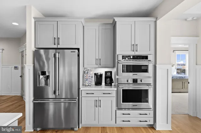 a spacious bedroom with a bed and large windows