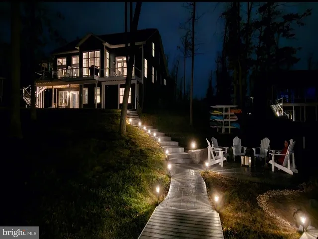 a view of a living room kitchen and a wooden floor