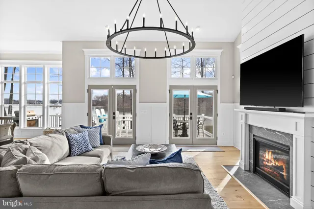 a kitchen with stainless steel appliances granite countertop a stove a sink and white cabinets