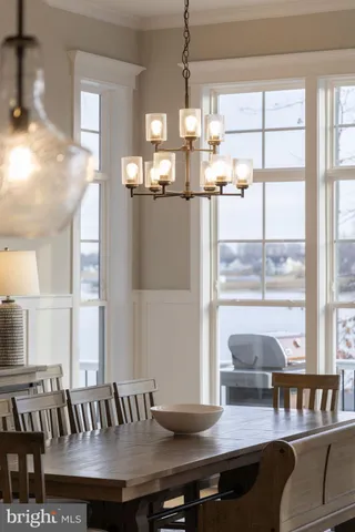 a view of a patio with table and chairs and potted plants