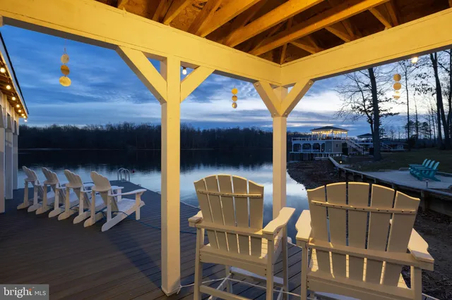 a kitchen with kitchen island granite countertop a table and chairs in it