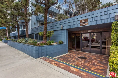 a view of a chairs and table in the patio