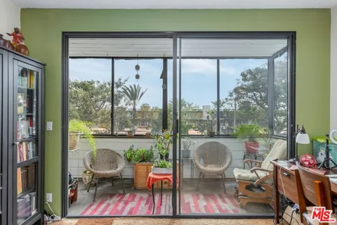 a room with furniture and a large window