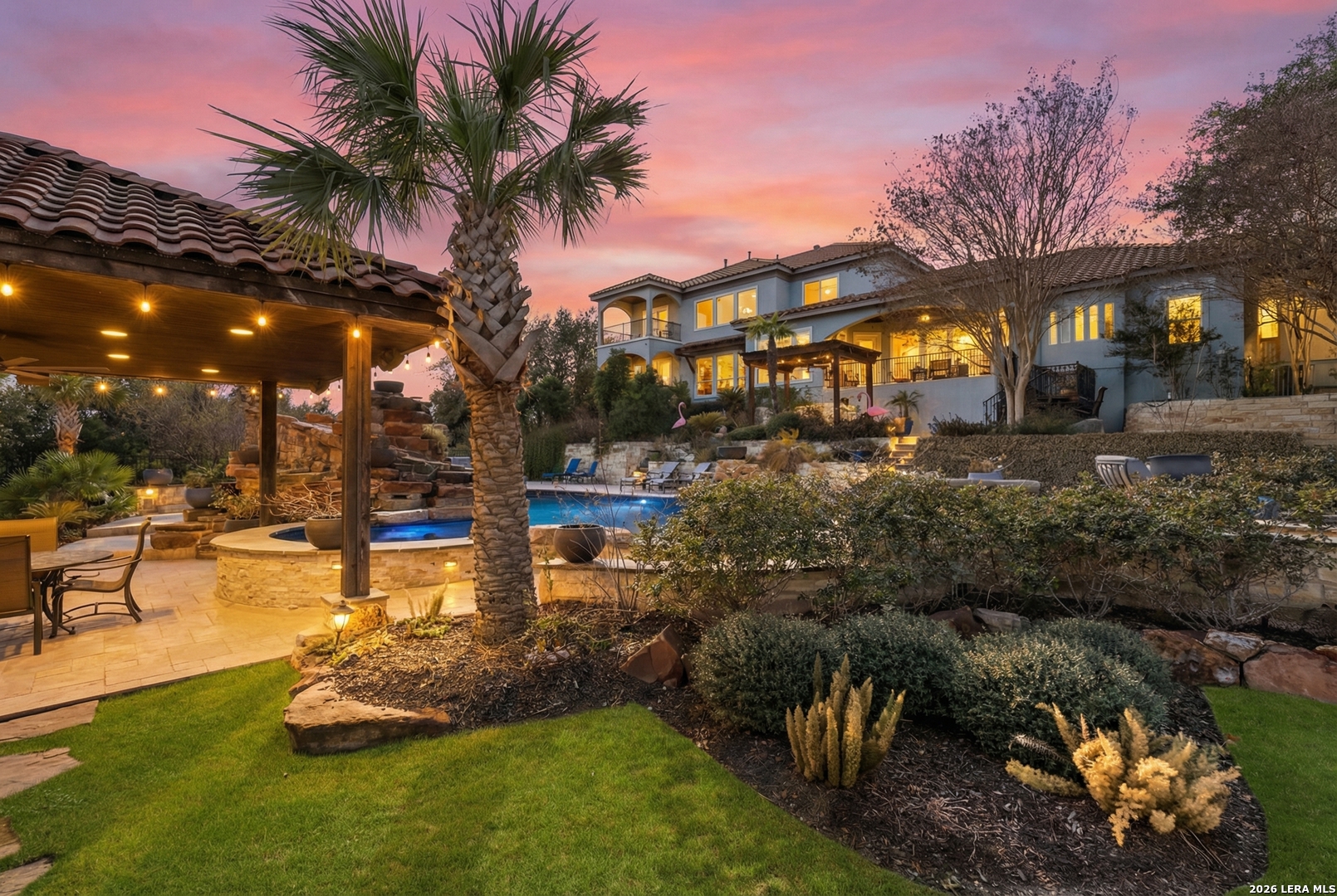 a swimming pool with outdoor seating and yard