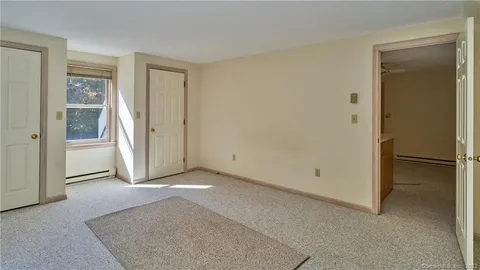 a view of a room with a hallway