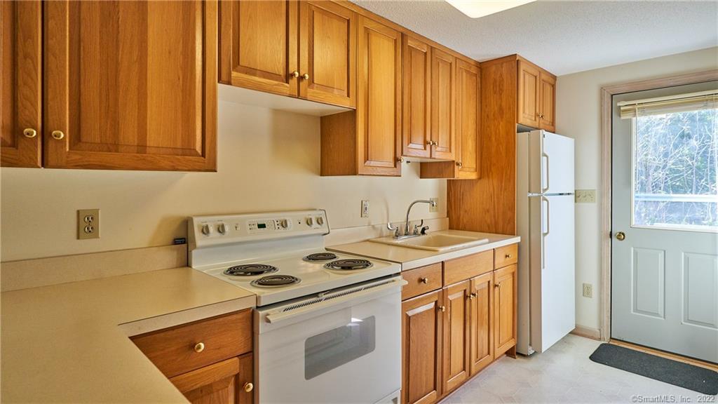 119 Kelseytown Road Clinton, CT 06413 - Photo 6 of 19 a kitchen with a stove a refrigerator and a sink
