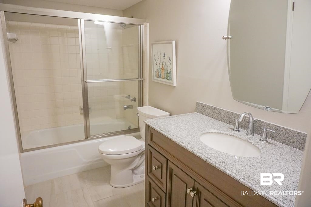 255 Suffolk Road Mobile, AL 36608 - Photo 25 of 29 Bathroom with vanity and combined bath / shower with glass door