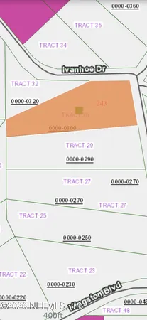 a picture of a field with trees in the background