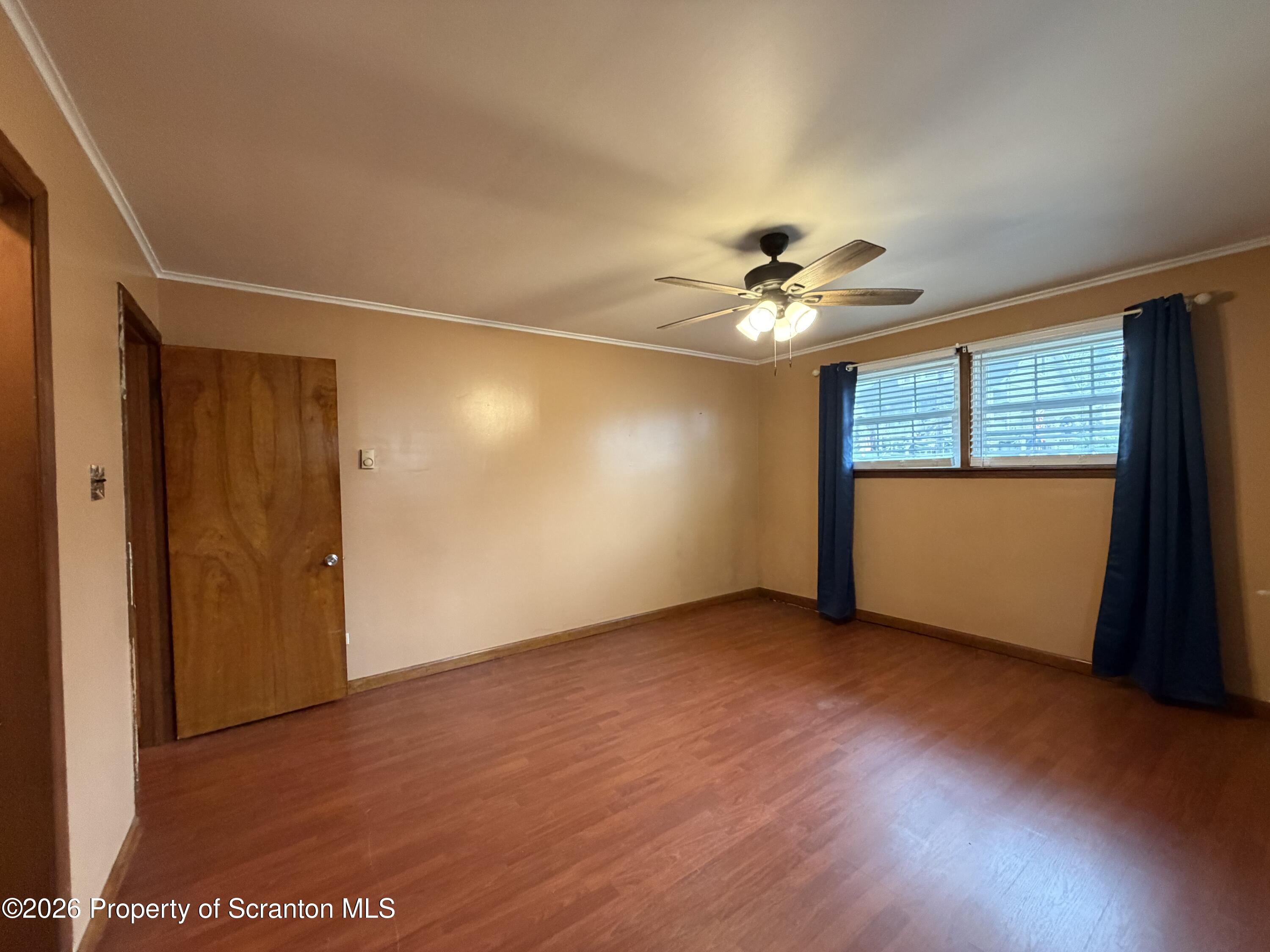 1019 Moosic Street Scranton, PA 18505 - Photo 24 of 43 an empty room with window and a ceiling fan