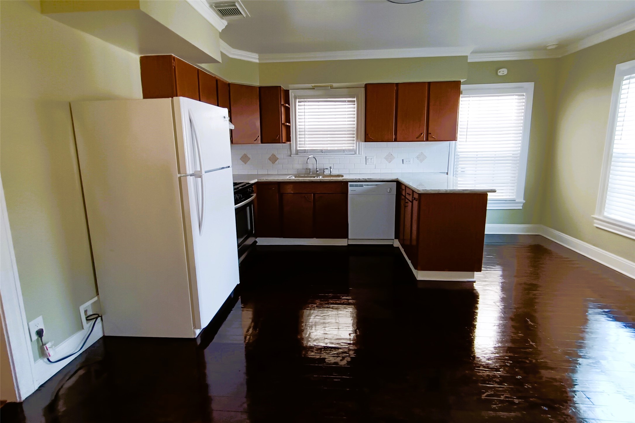 6906 Van Etten Street Houston, TX 77021 - Photo 12 of 30 Kitchen with Dishwasher, Gas Oven, and Microwave (not showing)