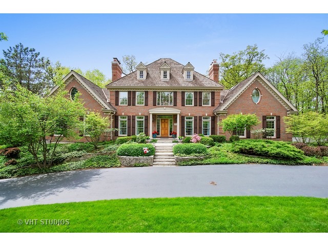 4N632 Hidden Oaks Road St. Charles, IL 60175 - Photo 1 of 25 a front view of a house with a yard and potted plants