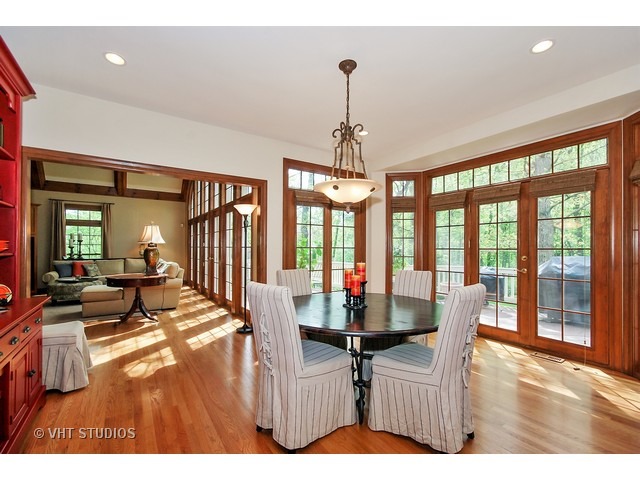 4N632 Hidden Oaks Road St. Charles, IL 60175 - Photo 11 of 25 a dining room with furniture wooden floor a chandelier and a rug