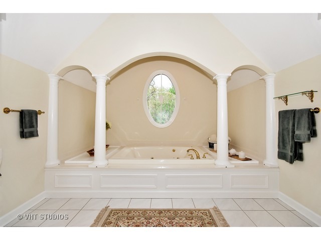 4N632 Hidden Oaks Road St. Charles, IL 60175 - Photo 18 of 25 a bathroom with a tub sink and mirror