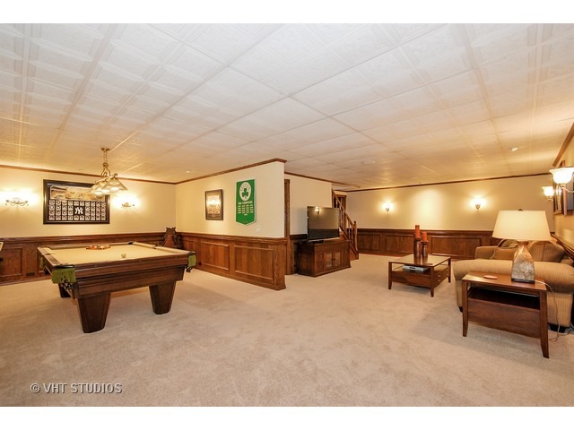 4N632 Hidden Oaks Road St. Charles, IL 60175 - Photo 23 of 25 a room with furniture and a flat screen tv