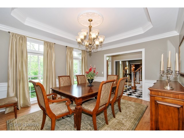 4N632 Hidden Oaks Road St. Charles, IL 60175 - Photo 5 of 25 a dining room with furniture a chandelier and wooden floor