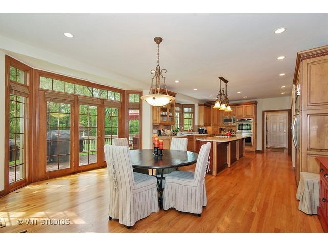 4N632 Hidden Oaks Road St. Charles, IL 60175 - Photo 7 of 25 a dining room with furniture a chandelier and wooden floor