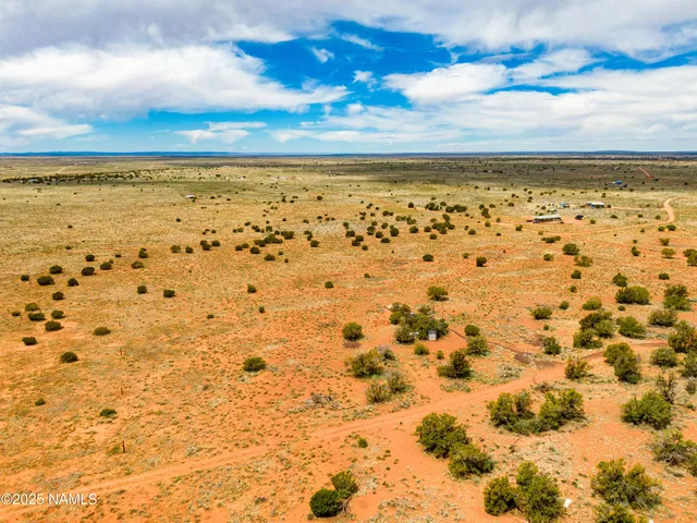 a view of beach with an ocean