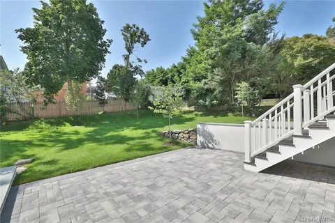 a view of a yard with flower plants