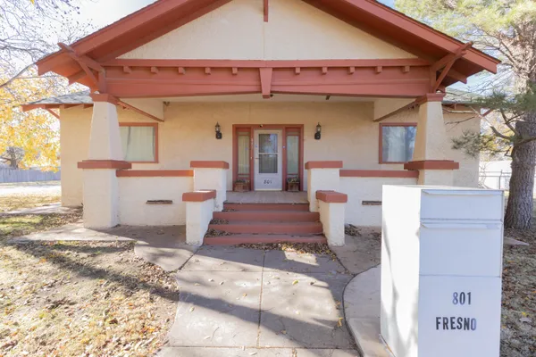 a front view of a house with a rug