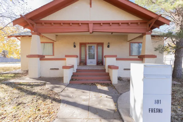 a front view of a house with a rug