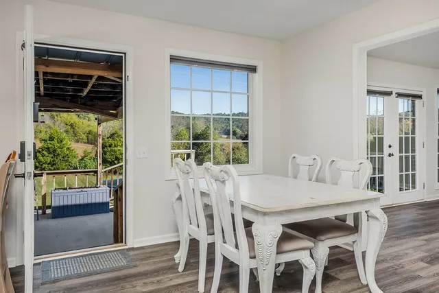 a view of a dining room with furniture window and outside view