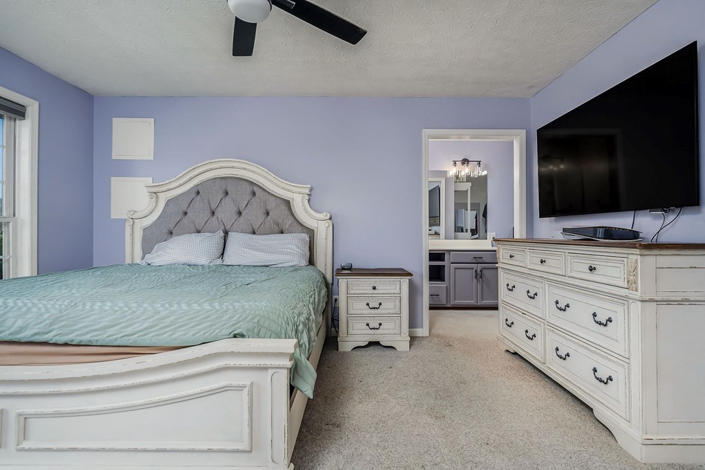 1945 Golden Mountain Road Sparta, TN 38583 - Photo 14 of 47 a bedroom with a bed and flat screen tv