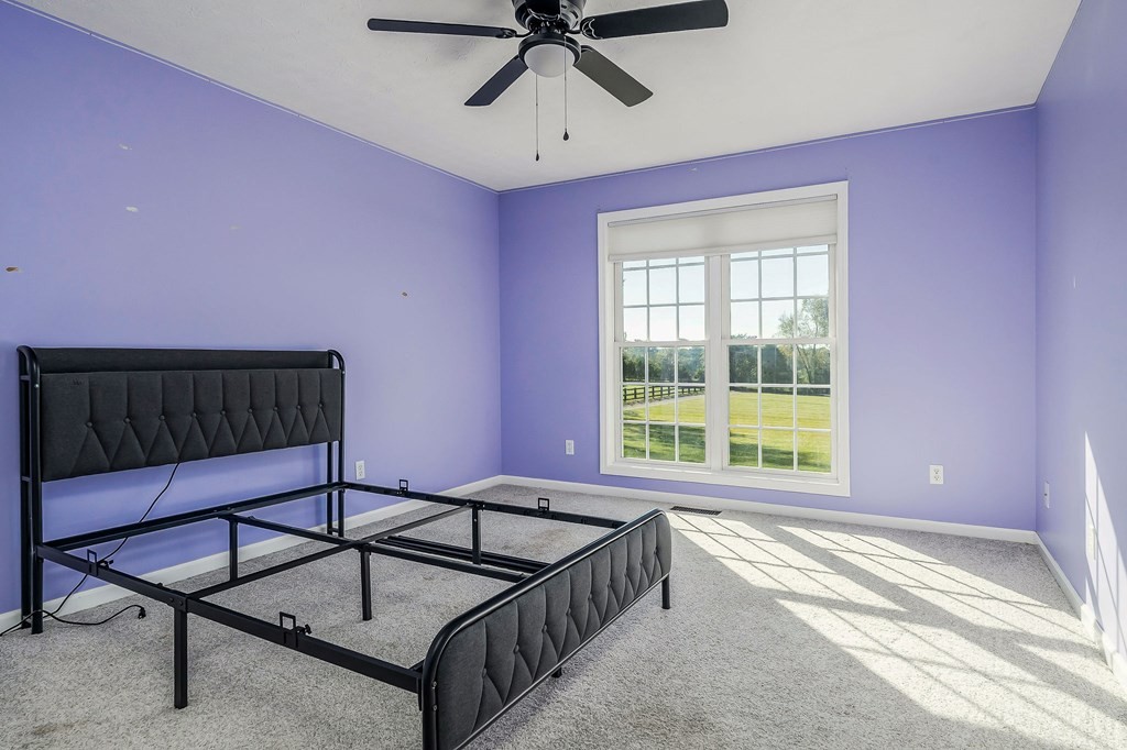 1945 Golden Mountain Road Sparta, TN 38583 - Photo 16 of 47 a living room with a couch a window and a chandelier