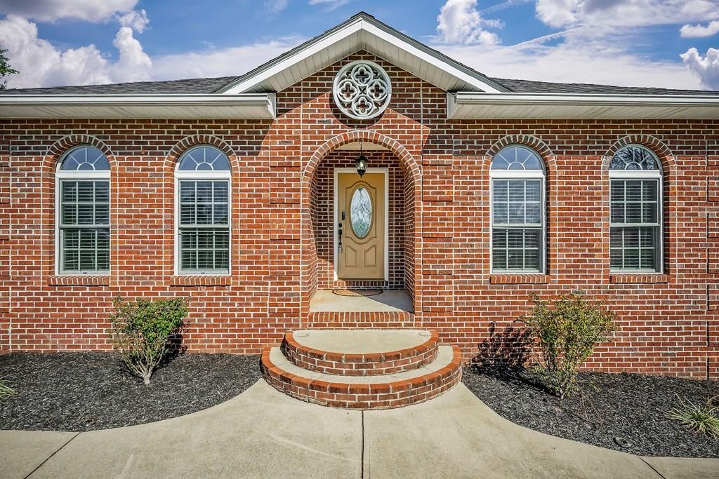 1945 Golden Mountain Road Sparta, TN 38583 - Photo 2 of 47 a front view of a house with a fountain