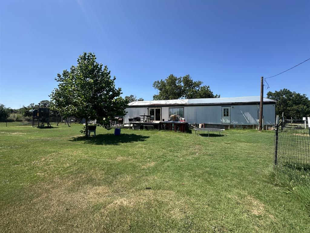 118 Rommel Court Springtown, TX 76082 - Photo 16 of 17 Back Yard and back of house