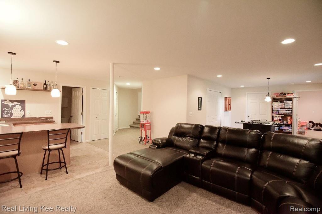 95 Ridge Field Court Oxford, MI 48371 - Photo 33 of 40 Finished basement with wet bar