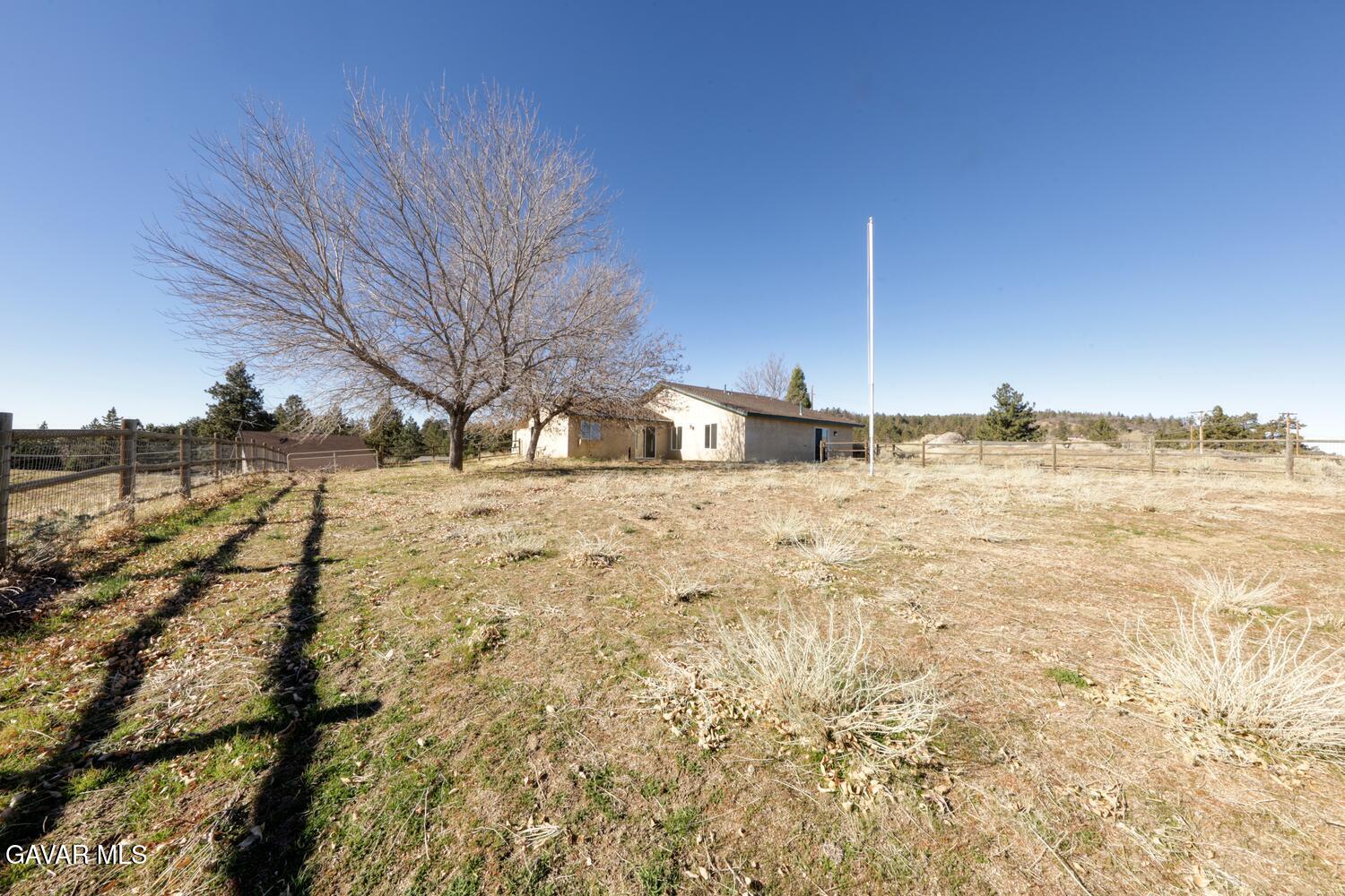 26801 Cabriolet Court Tehachapi, CA 93561 - Photo 51 of 60 a view of a yard with snow on the road