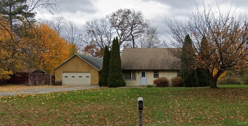 a front view of house with yard and trees