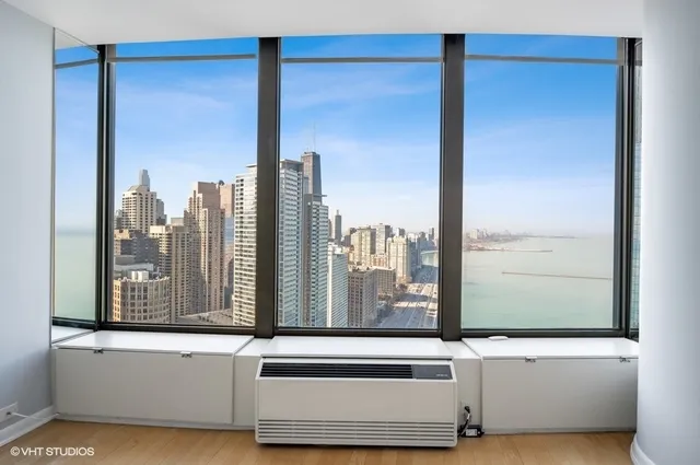 a view of a living room with a large window and floor to ceiling window