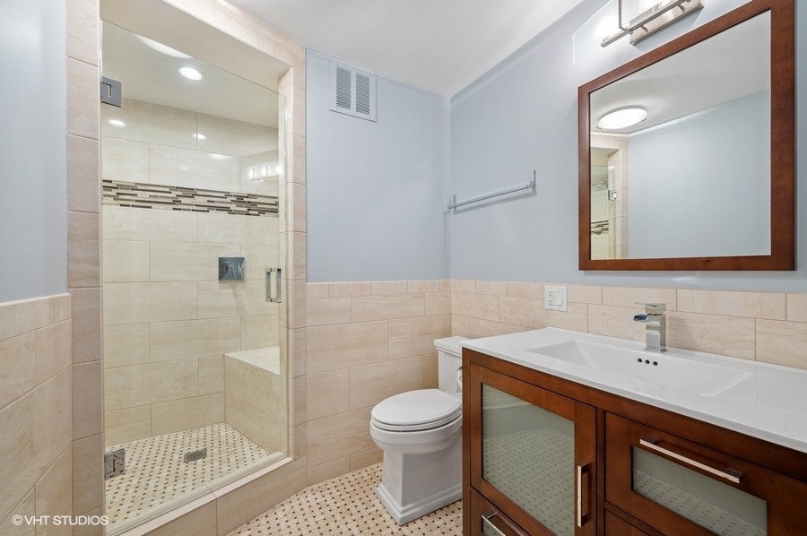 505 North Lake Shore Drive, Unit 4112 Chicago, IL 60611 - Photo 19 of 29 a bathroom with a sink a toilet and shower